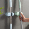 Front close-up of adhesive mop holder on bathroom wall