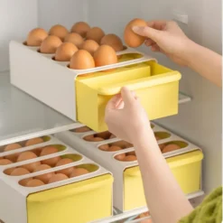 Compact plastic drawer-style egg storage box for 12 eggs