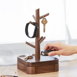 Nordic-style wooden key holder placed on a console table with accessories