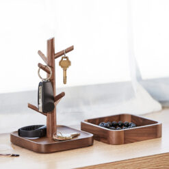 Nordic-style wooden key holder placed on a console table with accessories