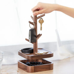 Nordic-style wooden key holder placed on a console table with accessories