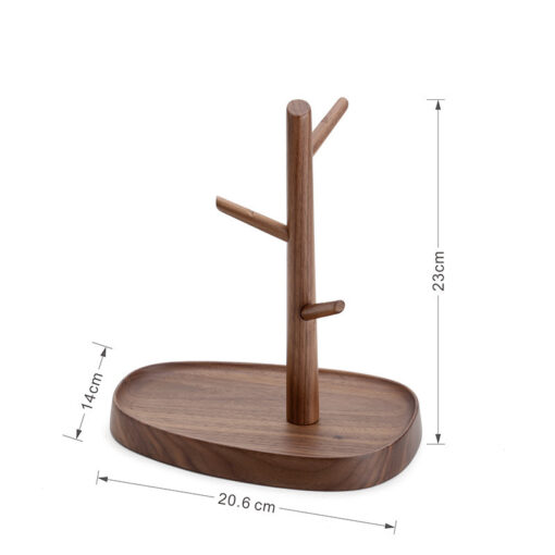 Nordic-style wooden key holder placed on a console table with accessories