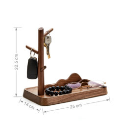Nordic-style wooden key holder placed on a console table with accessories