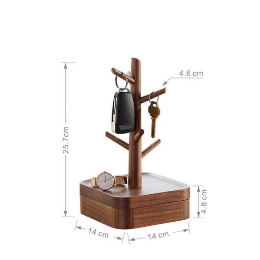 Nordic-style wooden key holder placed on a console table with accessories