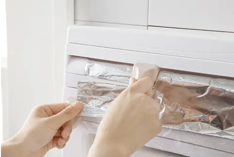 Wall-mounted kitchen wrap cutter and storage rack for foil, cling film, and paper towels