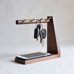 Wooden key holder with multiple hooks and tray for keys, phone, and small accessories