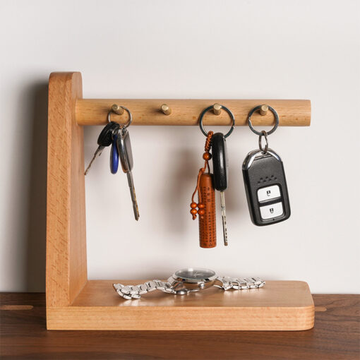 Wooden key holder with multiple hooks and tray for keys, phone, and small accessories
