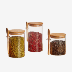 Transparent glass storage jar with wooden spoon and lid for kitchen pantry organizati