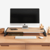 Ergonomic wooden monitor riser stand with modern spliced-leg design for office desk setup